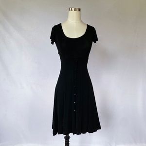Women's adorable black dress with buttons down the front and a pleat. Size M
